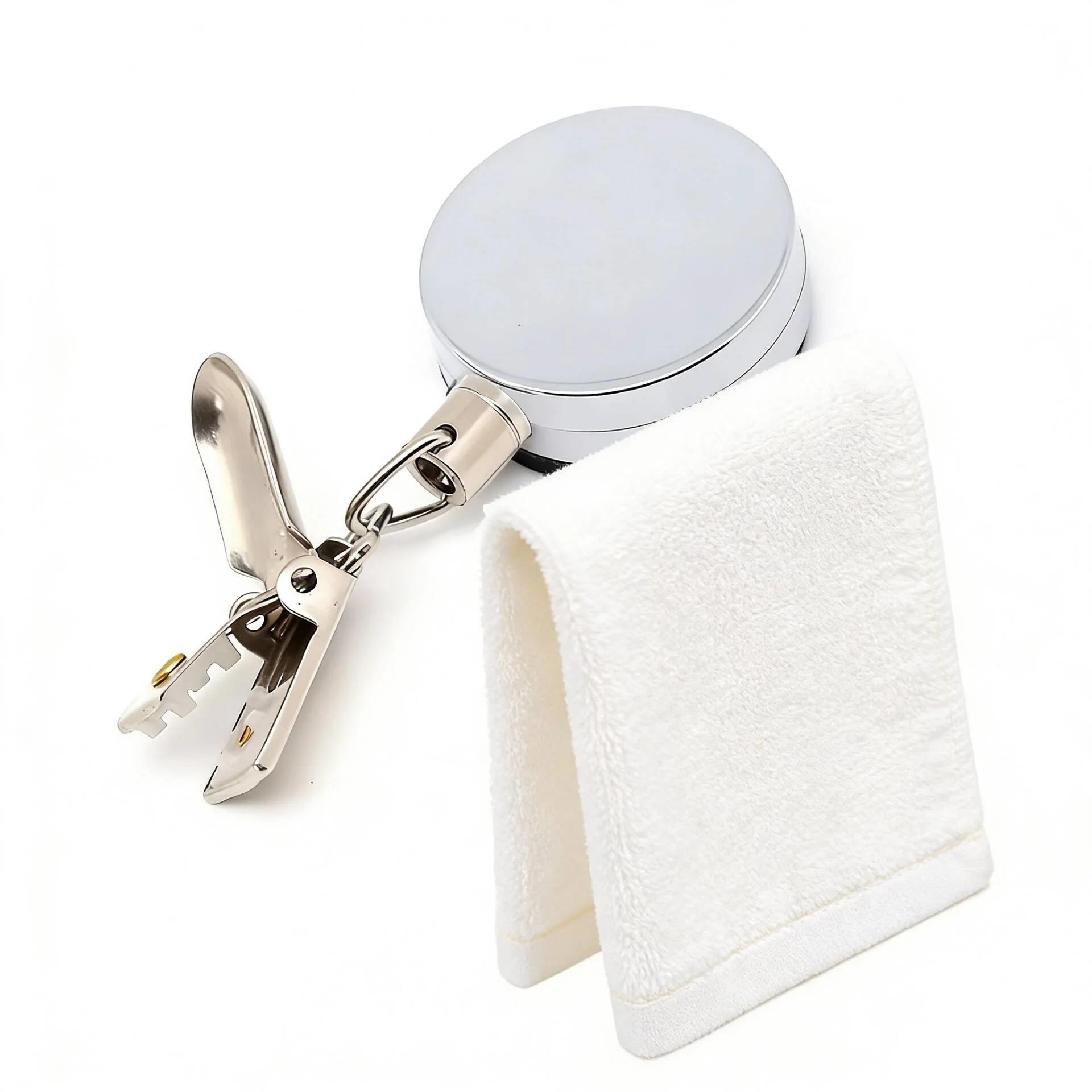 Retractable adhesive towel rack with circular mount and metal clip holding a white towel.
